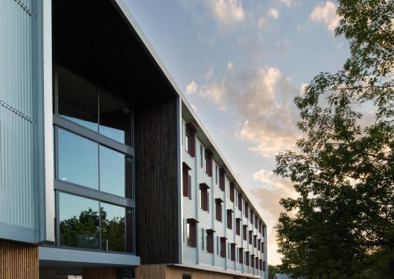 a building with a lawn and trees