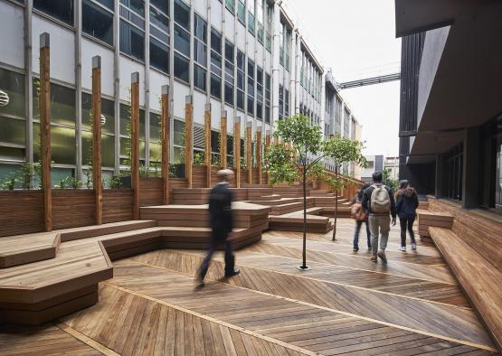 people walking in a courtyard