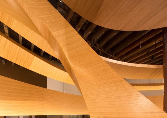 a wood paneled ceiling with a wood beam