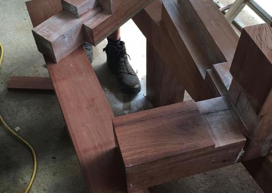 a man working on a piece of wood