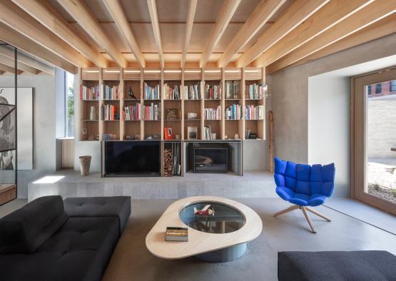 a living room with a fireplace and a couch