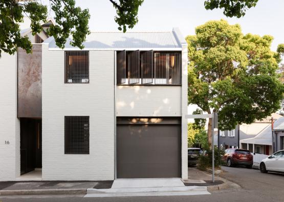 a white building with a garage