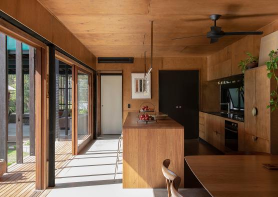 a kitchen with a table and chairs