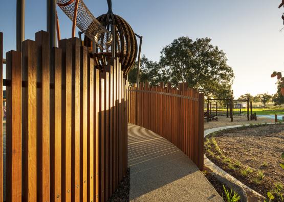 a walkway leading to a playground