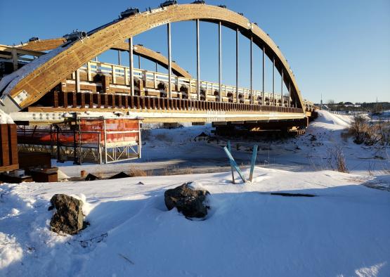 a bridge with a large arch over it