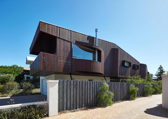 a house with a fence and a fence