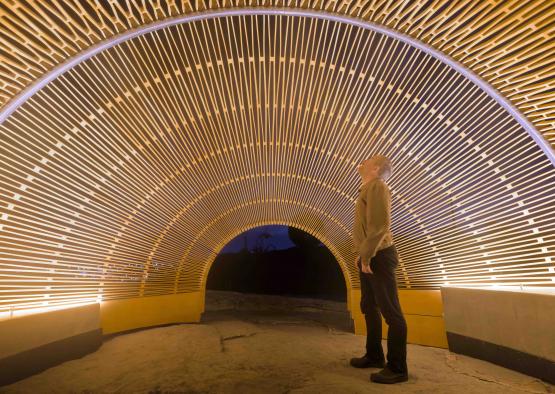 a man standing in a tunnel