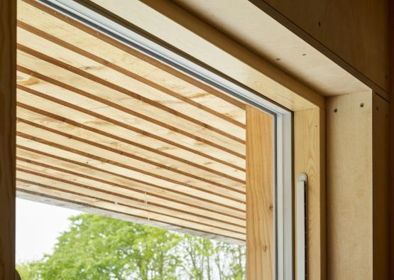 a window with a wooden slat overlay