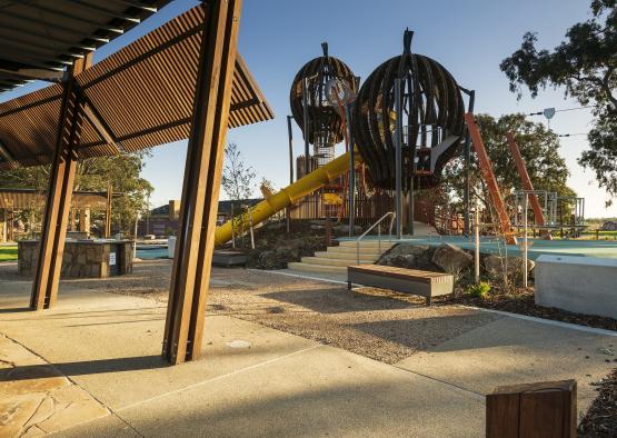 a playground with a yellow tube