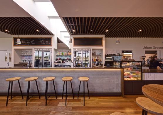 a bar with stools in front of a counter