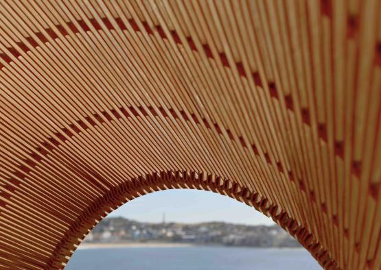 a wooden structure with a view of the water