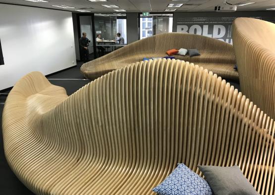 a group of wooden chairs in a room