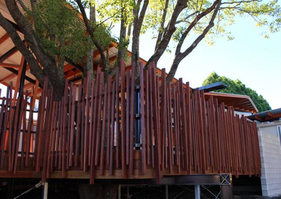 a tree house with a fence