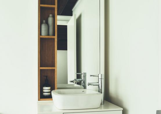 a bathroom with a mirror and sink