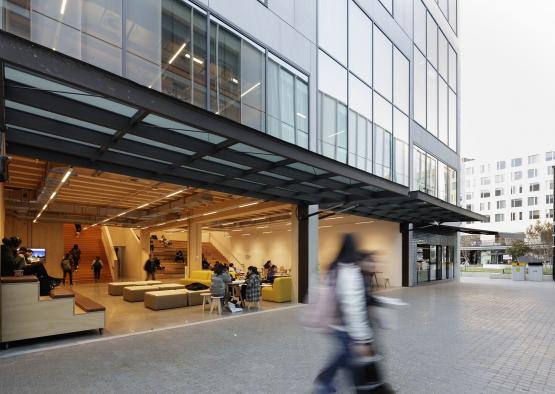 people walking past a building