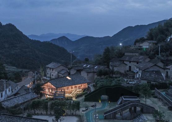 a group of houses with lights on