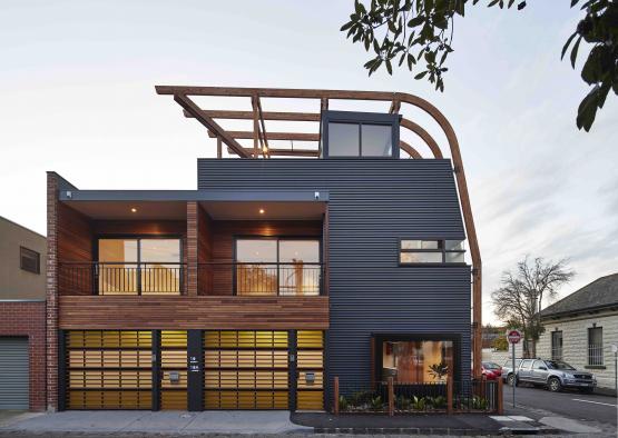 a building with a garage and a parking lot