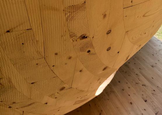 a wood ball with a wood floor and a wood floor