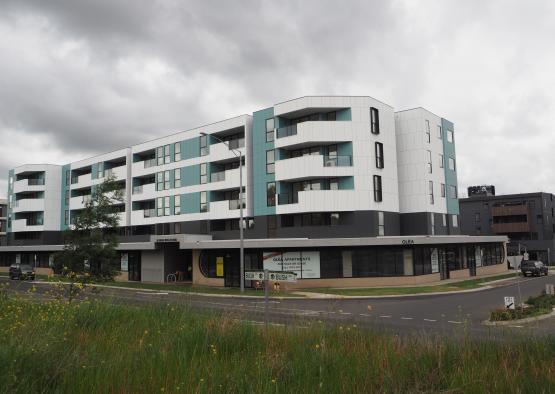 a building with grass and trees