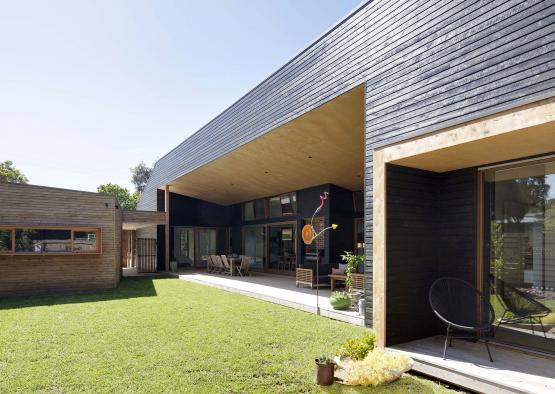 a house with a lawn and a patio