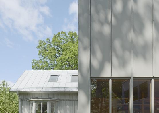 a building with windows and a couple of kids