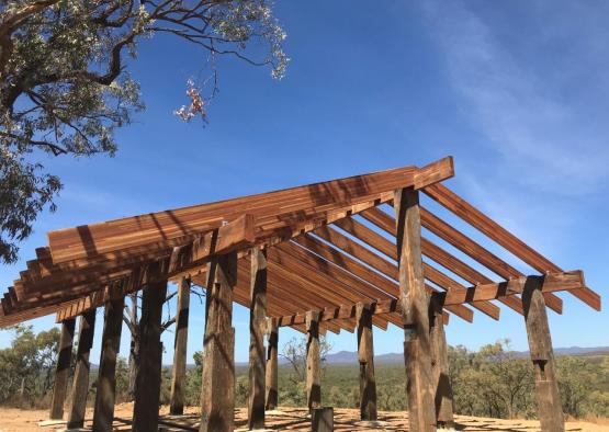 a wooden structure under a blue sky