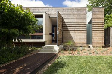 a house with a walkway and a walkway leading to it