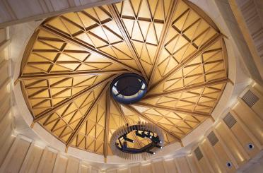 a circular ceiling with a spiral staircase