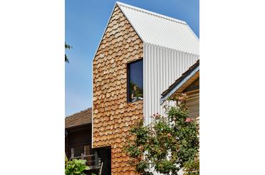 a person in a window on a house