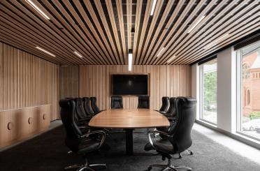 a conference room with a table and chairs