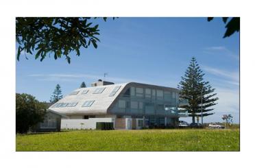 a building with a curved roof