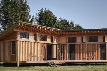 a building with a deck and a porch